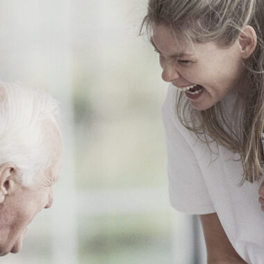 Nurse with man on porch